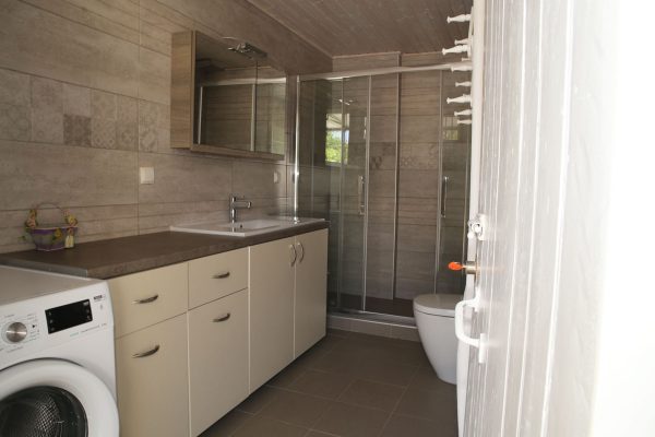 Hidden Gem Kefalonia (House Rental) a bathroom with a washer and a toilet