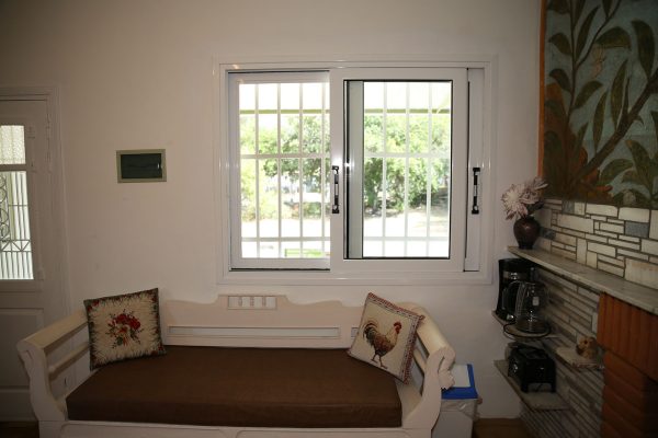 Hidden Gem Kefalonia (House Rental) a couch with pillows and pillows in a room